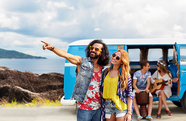 Image showing happy hippie couples and minivan on island