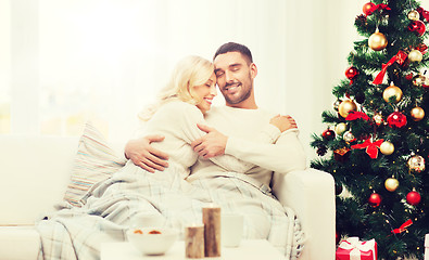 Image showing happy couple at home with christmas tree