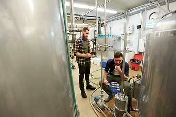 Image showing men with tablet pc at craft beer brewery filter