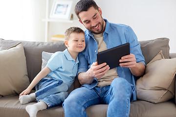 Image showing father and son with tablet pc playing at home