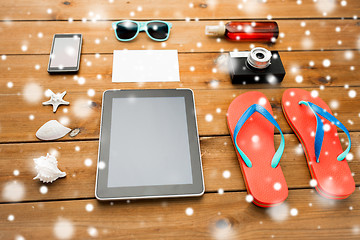 Image showing tablet pc and beach stuff