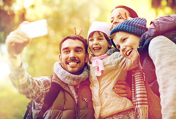 Image showing family taking selfie with smartphone outdoors