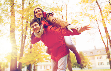 Image showing happy young couple having fun in autumn park