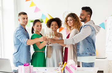 Image showing happy team with champagne at office birthday party