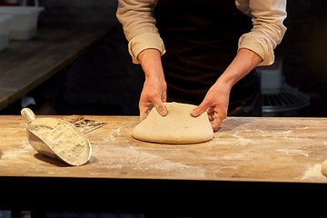 Image showing chef or baker cooking dough at bakery