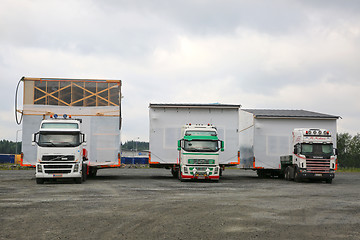 Image showing Three Oversize Load Transports in a Row