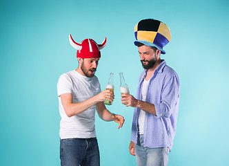 Image showing Two Excited Male Friends Celebrate Watching Sports