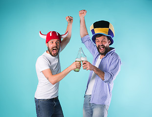 Image showing Two Excited Male Friends Celebrate Watching Sports