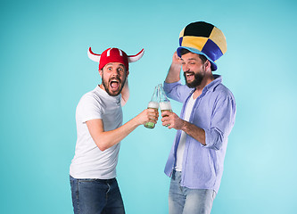 Image showing Two Excited Male Friends Celebrate Watching Sports