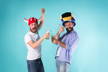 Image showing Two Excited Male Friends Celebrate Watching Sports