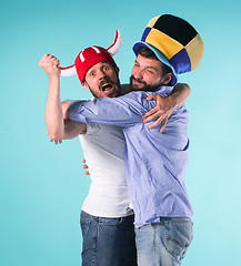 Image showing Two Excited Male Friends Celebrate Watching Sports