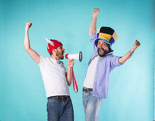 Image showing Two Excited Male Friends Celebrate Watching Sports