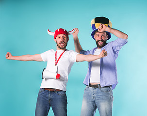 Image showing Two Excited Male Friends Celebrate Watching Sports