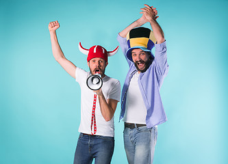 Image showing Two Excited Male Friends Celebrate Watching Sports