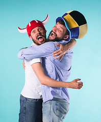 Image showing Two Excited Male Friends Celebrate Watching Sports