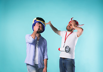 Image showing Two Excited Male Friends Celebrate Watching Sports