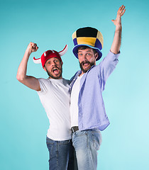 Image showing Two Excited Male Friends Celebrate Watching Sports