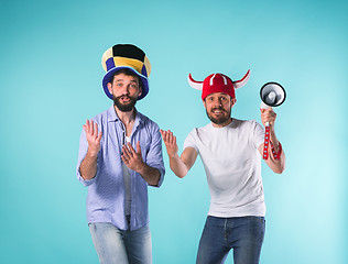 Image showing Two Excited Male Friends Celebrate Watching Sports