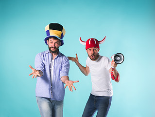 Image showing Two Excited Male Friends Celebrate Watching Sports