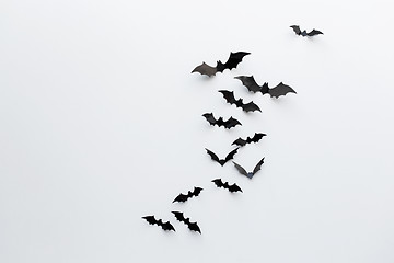 Image showing black paper bats over white background