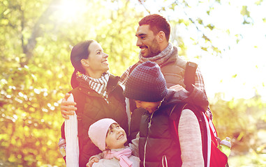 Image showing happy family with backpacks hiking