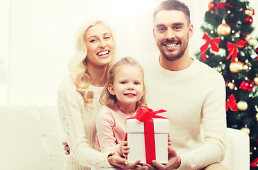 Image showing happy family at home with christmas gift box