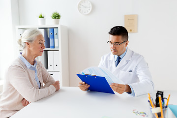 Image showing senior woman and doctor meeting at hospital