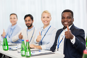 Image showing people at business conference showing thumbs up