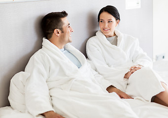 Image showing happy couple in bed at home or hotel room