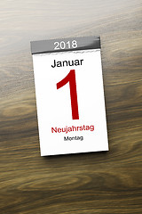 Image showing a calendar the 1st of January new year day text in german langua