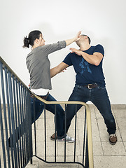 Image showing young woman fighting with man