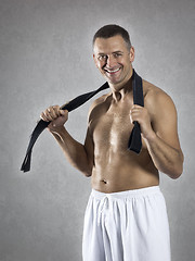 Image showing middle age martial arts sports man with a black belt