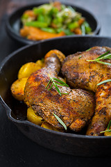 Image showing Baked chicken legs with potatos