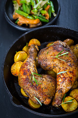 Image showing Baked chicken legs with potatos