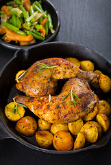 Image showing Baked chicken legs with potatos