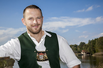 Image showing bavarian tradition man at the lake