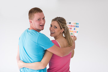 Image showing couple looking at color samples at home