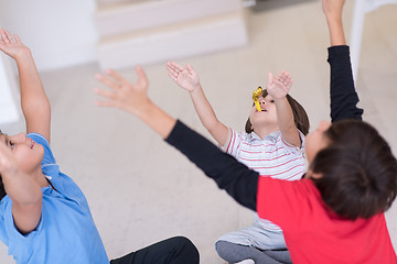 Image showing young boys having fun on the floor