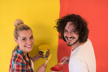 Image showing couple painting interior wall