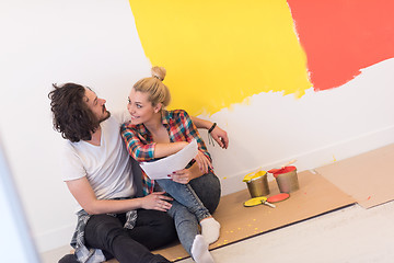 Image showing Happy young couple relaxing after painting