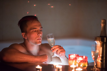 Image showing man relaxing in the jacuzzi