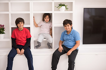 Image showing young boys posing on a shelf