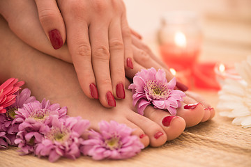 Image showing female feet and hands at spa salon