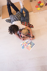 Image showing Happy young couple relaxing after painting