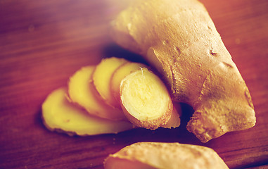 Image showing close up of ginger root on wooden table