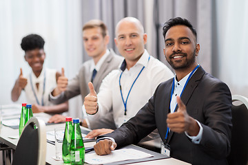 Image showing people at business conference showing thumbs up