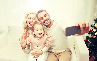 Image showing family taking selfie with smartphone at christmas