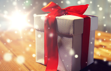 Image showing close up of christmas gift box on wooden table