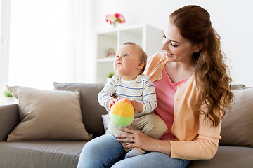 Image showing happy young mother with little baby at home