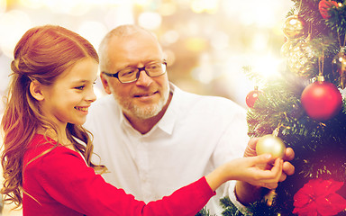 Image showing grandfather and granddaughter at christmas tree